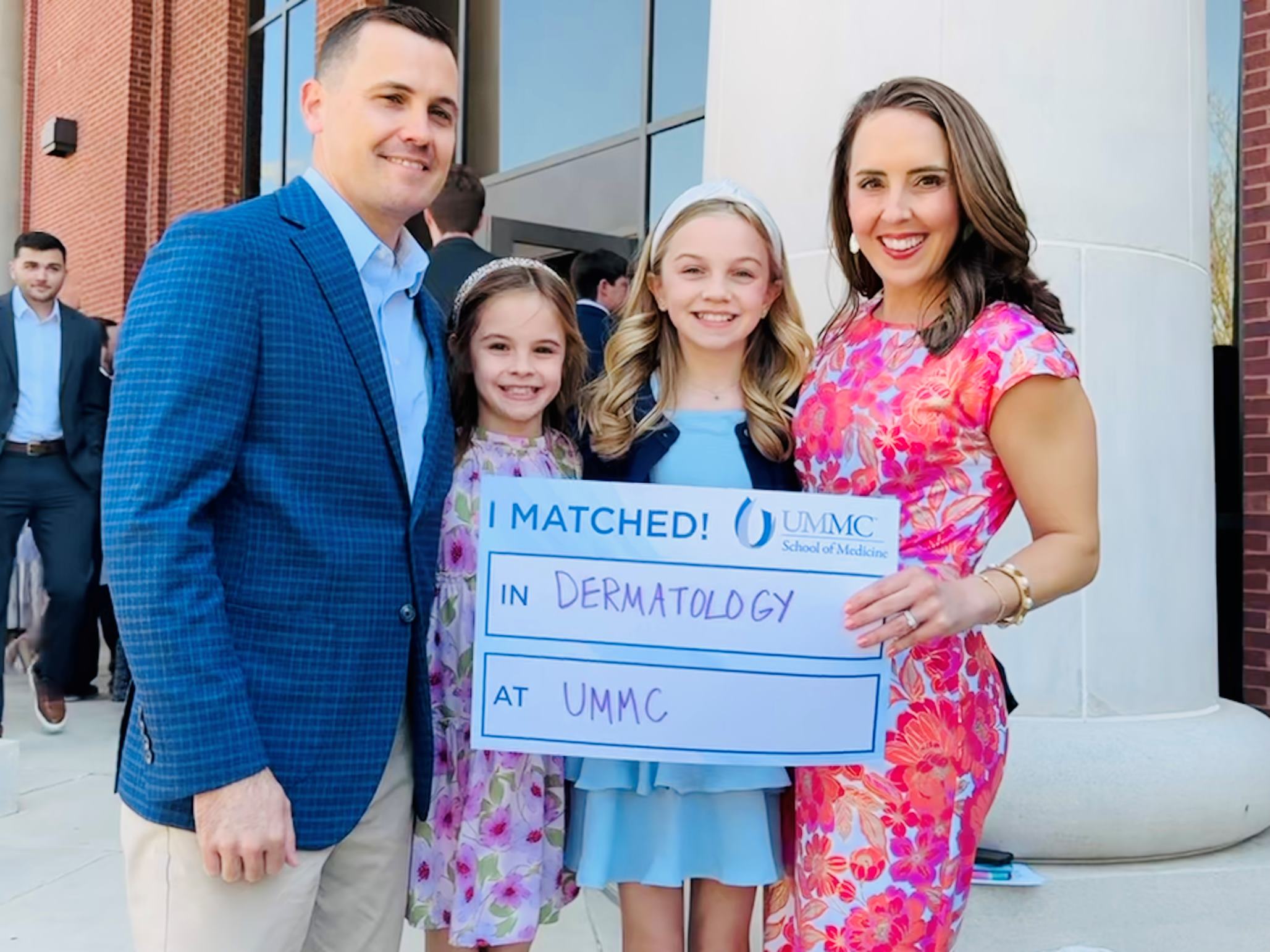 Jenna Benge, MD poses with family.